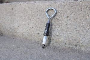 Spark plug bottle opener