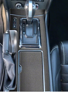 Center console shifter accent trim; Domed carbon fiber